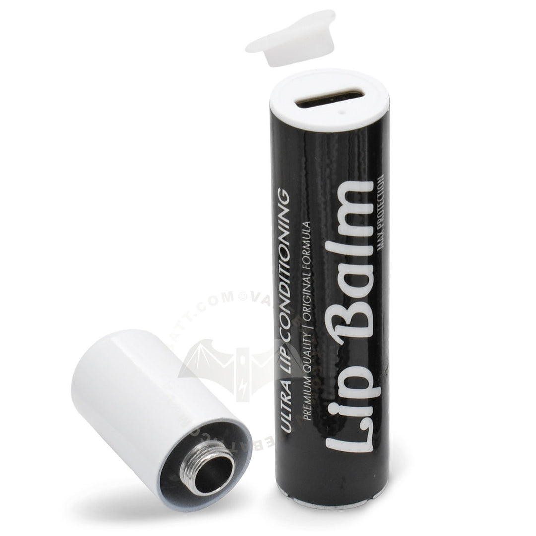 A black cylindrical lip balm cart battery with a white cap, shown standing upright with the cap removed and lying on its side. The label reads 'Lip Balm'